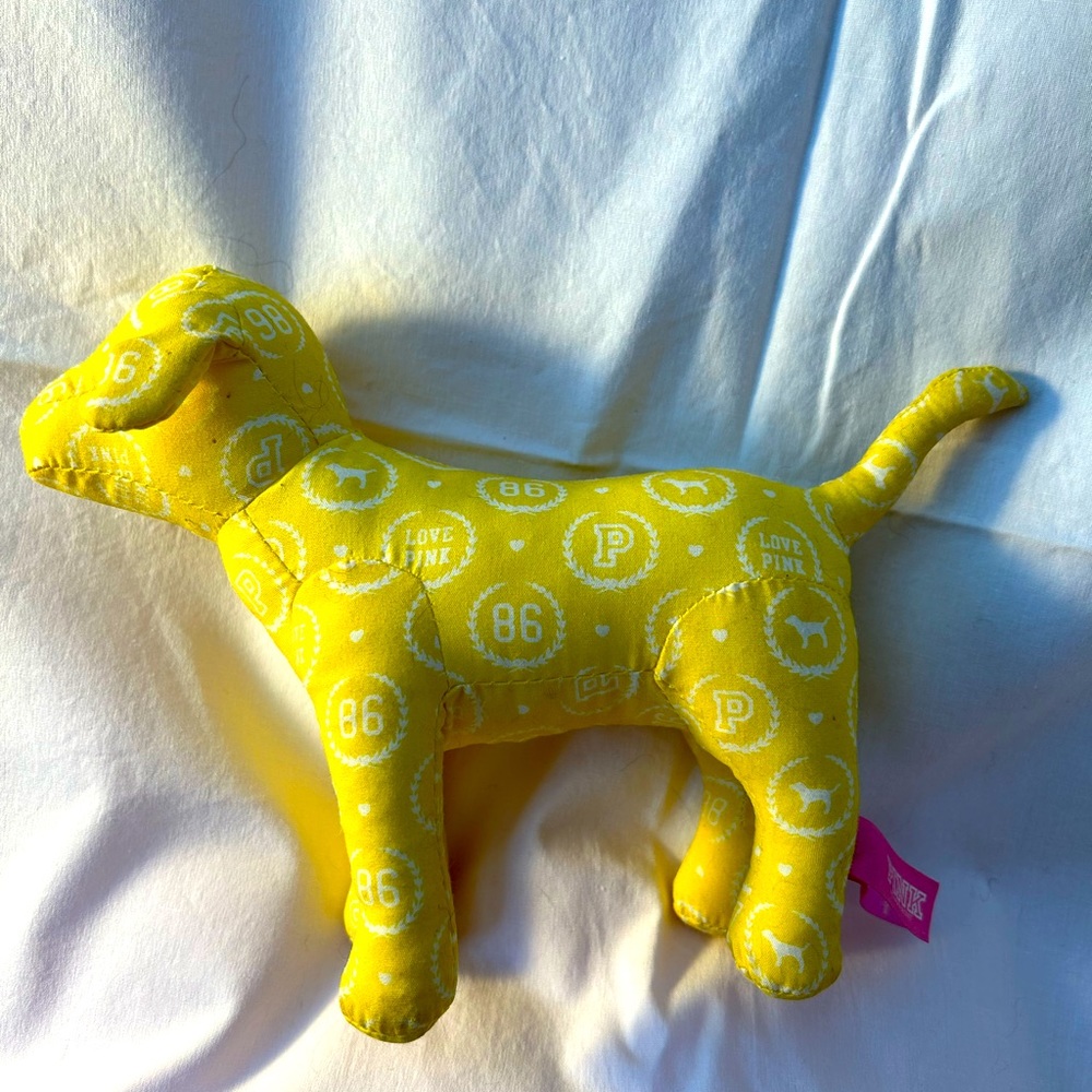 Victoria secret iconic dog “Pink” in yellow
